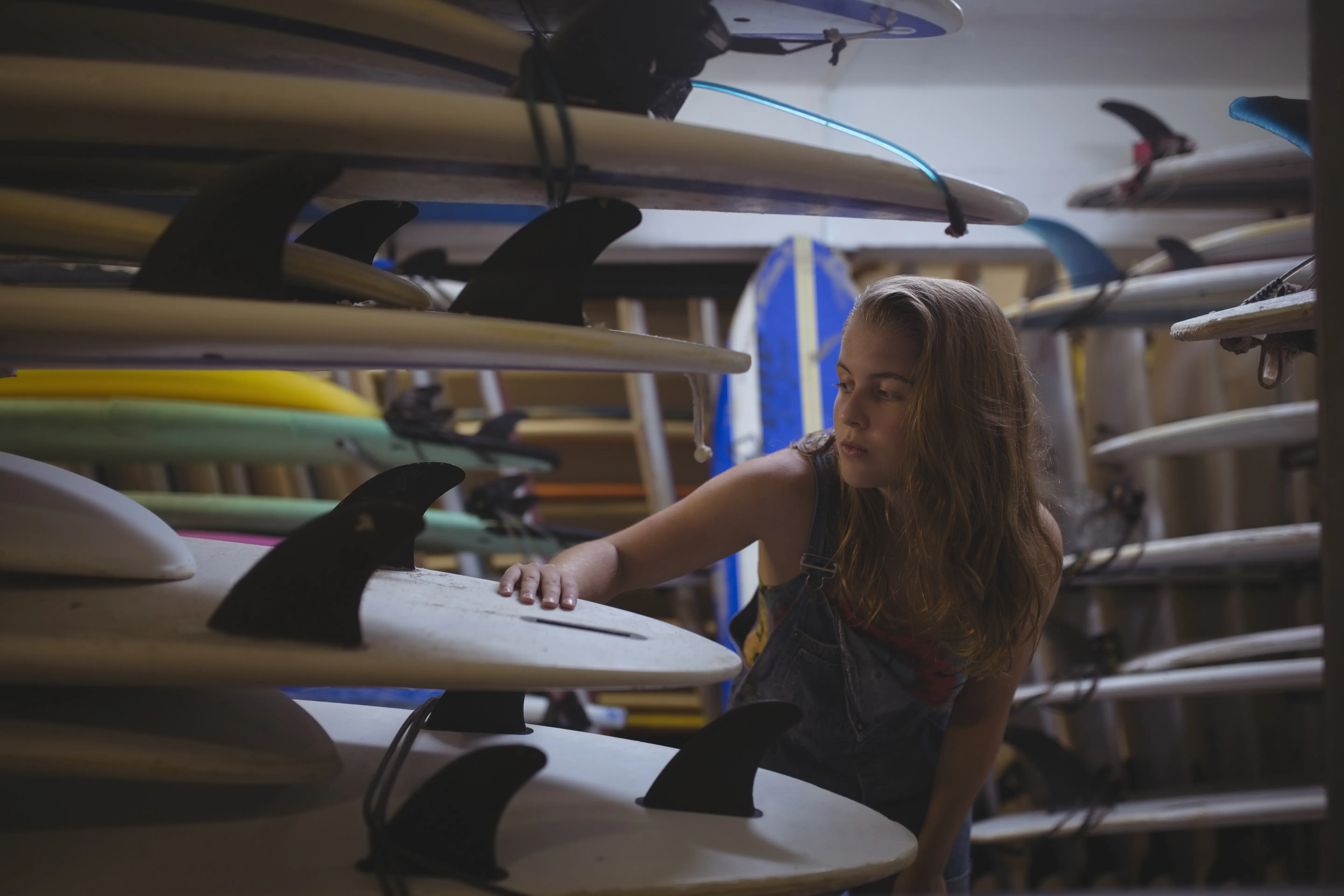 Woman choosing a surfboard